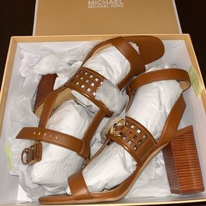 Size 8.5 Michael Kors high heels. Never worn just tried on.